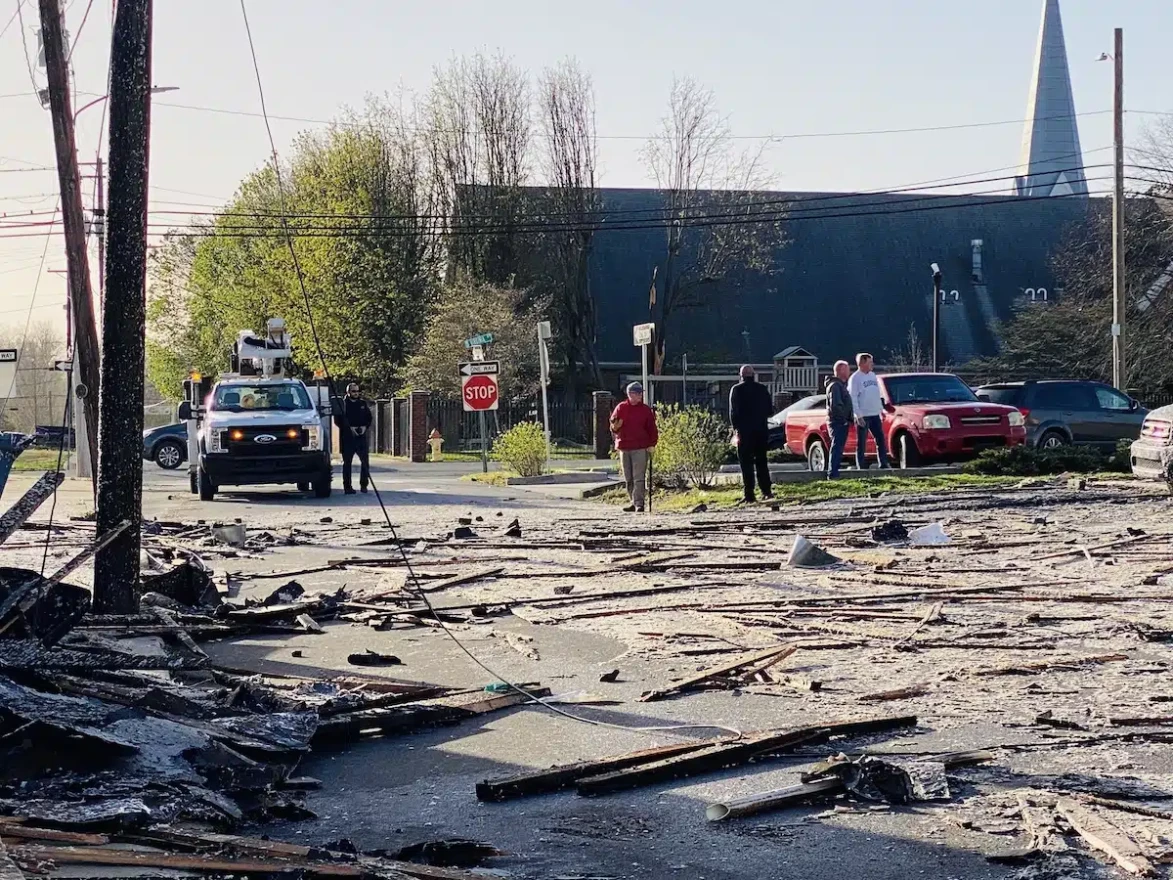 Residents look at the storm damage Saturday morning on Fifth Street.